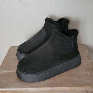 Black faux fur lined slip on boots